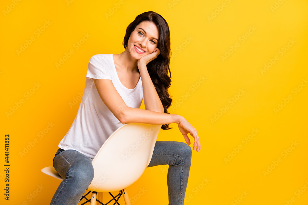 Canvas Prints Portrait of lovely cheerful girl sitting in chair copy empty space isolated over bright yellow color background