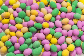 Group of colorful peanuts in glaze.