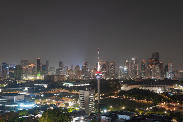Fototapeta na wymiar city skyline at night at Rooftop House of Representative of Indonesia