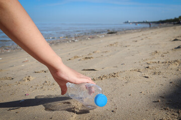 Environment, Ecology Care, Renewable Concept. Volunteer or Traveller Collecting Plastic Bottle Waste on the Beach Sand. Keep Beach Clean