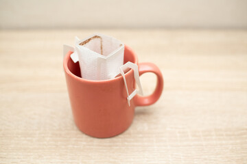 Coffee Drips in cup. Alternative brewing specialty coffee in paper filter bags.