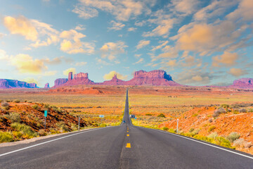 Fototapeta na wymiar The Monument Valley road in sunset, the famous place where they filmed the Forrest Gum movie. Utah