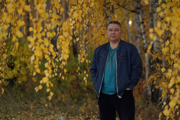 a man in the autumn forest