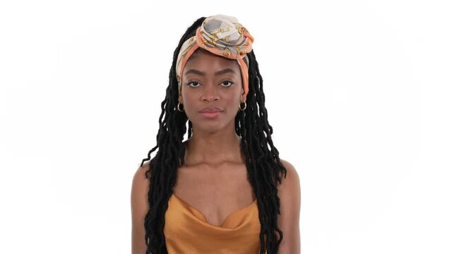 Portrait of an annoyed African woman rolling her eyes. Isolated on a white background.
