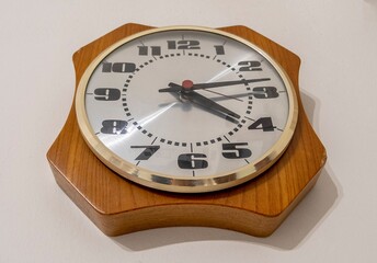 Vintage analog clock hanging on the wall
