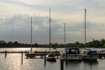 Fototapeta na wymiar sailboats in the marina at Kalvehave on the Ulv Sound in Denmark at sunset