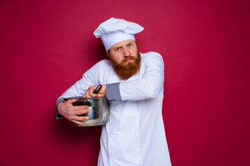 chef with beard and red apron is jealous of his recipe