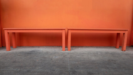 orange color chair on a orange wall