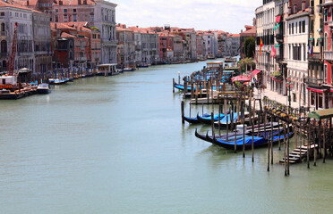 Obraz premium Grand Canal is the widest communication route on the water of Venice without boats sailing the cause of the coronavirus which caused a tremendous and an unprecedented economic-financial crisis