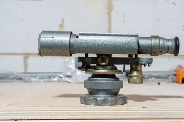 close up of an antique analogue architects and engineers land surveying level used to measure and set out buildings, roads and services