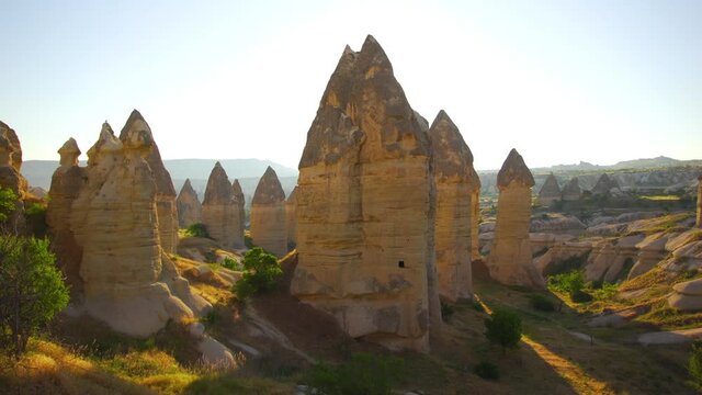 4k stock video footage of unusual sunny sunrise morning scenic landscape of volcanic turkish Cappadocia. Love Valley, Turkey, Anatolia