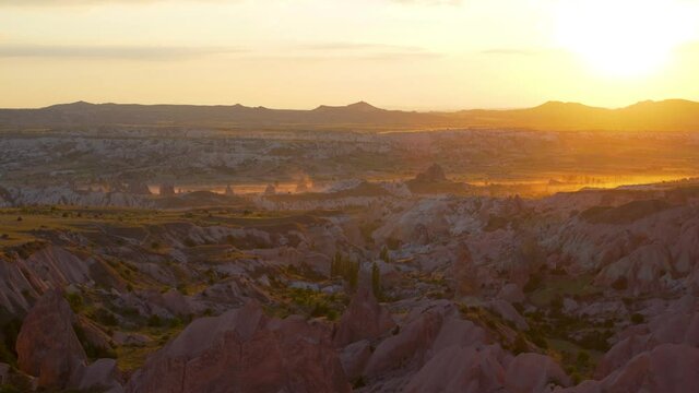 4k stock video footage of amazing sunny aerial view on scenic ancient valleys of Cappadocia, Turkey