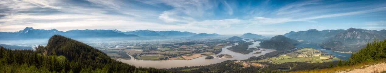 Fototapeta premium Panoramic View of Fraser Valley from top of the mountain. Canadian Nature Landscape Background. Harrison Mills near Chilliwack, British Columbia, Canada.