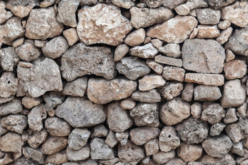 Old outdoor house wall made of stones, seamless