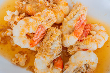 Fried Shrimp with Garlic and Pepper on white dish. Local food in Thailand. Regional Food Backgrounds