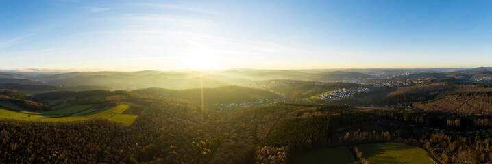 the siegerland forest and city from above in germany in autumn as a high definition panorama