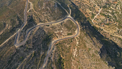 Aerial drone photo of winding road leading to iconic paradise beach of Melidoni, Kythera island, Ionian, Greece