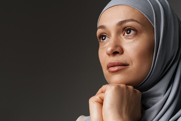 Middle eastern woman in hijab posing and looking aside