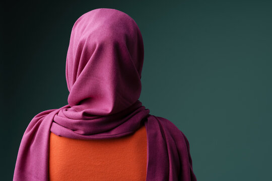 Back View Photo Of Muslim Woman In Hijab Posing At Camera