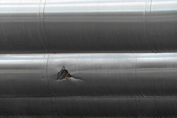Mechanical damage, crack on the steel pipe of the overpass close-up copy space
