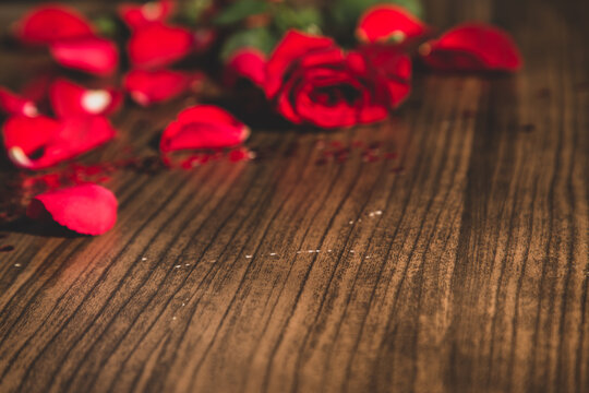 Romantic background with red rose on wood table,Valentine day,Selective focus
