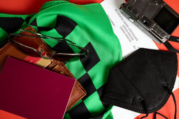 Naklejka premium Covid vaccination certificate, passport, sunglasses and masks
