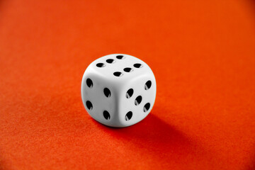 White dice isolated on orange background