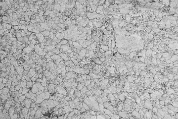 Background of old weathered flour mill granite stone. Colors of white, gray and black granite, stone over a hundred years old.