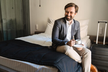 Smiling mid aged bearded man in formal wear