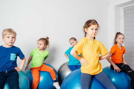 Engaged kids while physical education lessons at preschool
