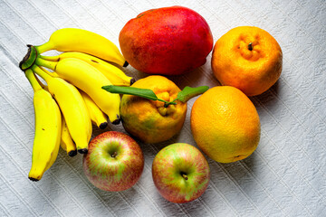 Tropical fruit mix on a table with white tablecloth
