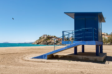blue lifeguard station at bolnuevo beach, alicante, spain, closed and no people on the beach