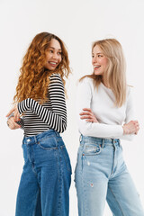 Young two women smiling and looking at each other