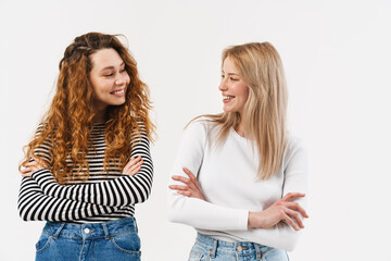 Young two women laughing and looking at each other