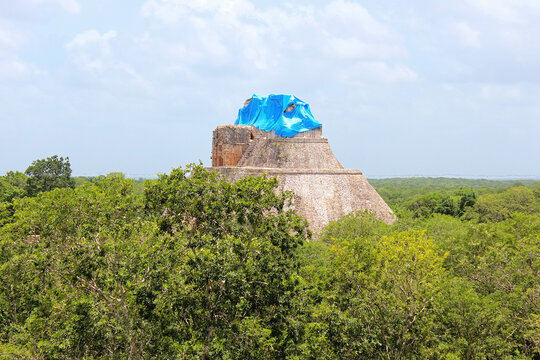 Uxmal, Aerial view on the Pyramid of the Magician from the top of Great Pyramid at archaeological and historical site of Uxmal, representative of the Puuc architectural style, Yucatan, Mexico