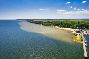 Pier and beach in Puck on the Bay of Puck at summer. Poland
