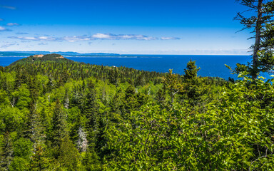 Fototapeta na wymiar View on the Atlantic Ocean from the Petit Mont St Anne, a small moutain located located within the Percé Unesco Geopark in Gaspesie (Quebec, Canada)