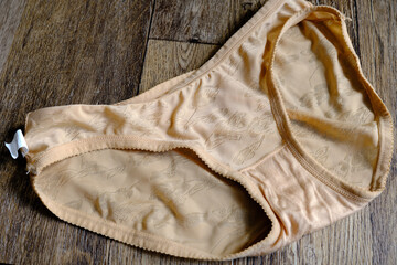Popular and cheap woman panties made from cotton with light grayish orange color