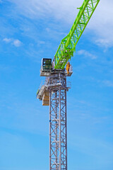 Naklejka premium construction crane at blue sky background
