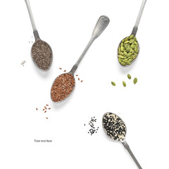 Set of various seeds in spoons isolated on white background. Pumpkin, flax, sesame and chia seeds....