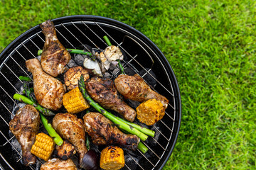 Grilled Food on Charcoal BBQ. Summer Picnic in Backyard Garden