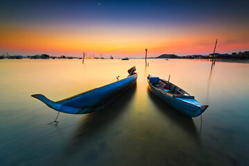 Naklejka premium Traditional boat at beauty sunset in Bataam Island