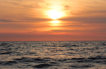 Evening sun over the tropical sea with waves