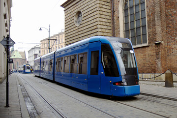 Fototapeta na wymiar Blue tram in the city