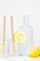 Lemon water with bamboo straw. Healthy detox drink. Reusable bamboo straws as an alternative for single-use plastic straws, healthy and sustainable lifestyle concept
