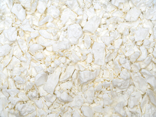 Cottage cheese. Fresh cottage cheese on a white background. Homemade curd in minimalism style. Top view.