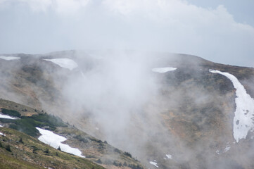 Fog on a mountain range in the Carpathian mountains