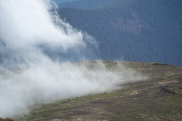 Fog on a mountain range in the Carpathian mountains