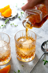 Whiskey, brandy or bourbon alcohol drink in crystal glasses