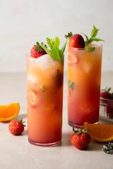 Strawberry lemonade sangria with fresh orange fruit and mint. Refreshing summer fruit cocktails.